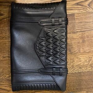 Reece Hudson black leather clutch.